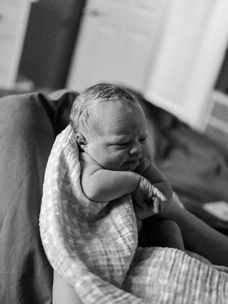 Newborn baby, home birth, black and white film image