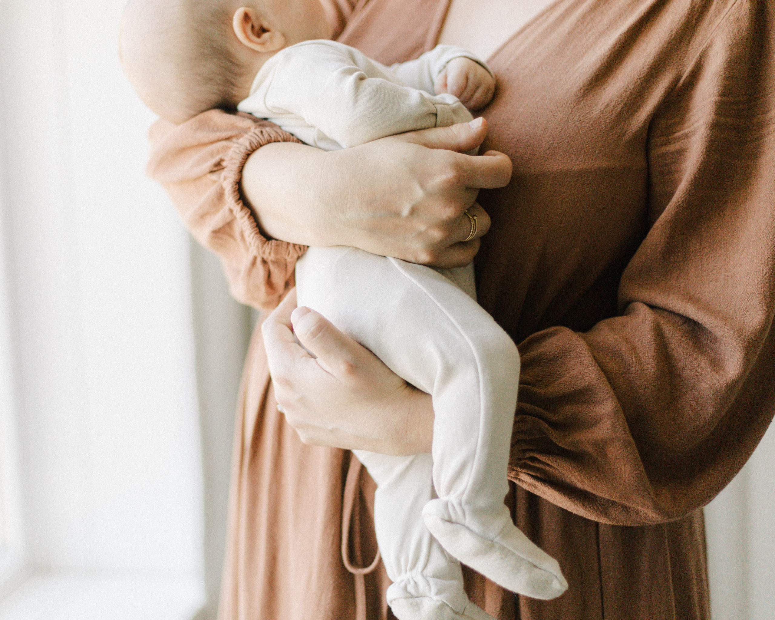 Newborn session with baby in mom's arms